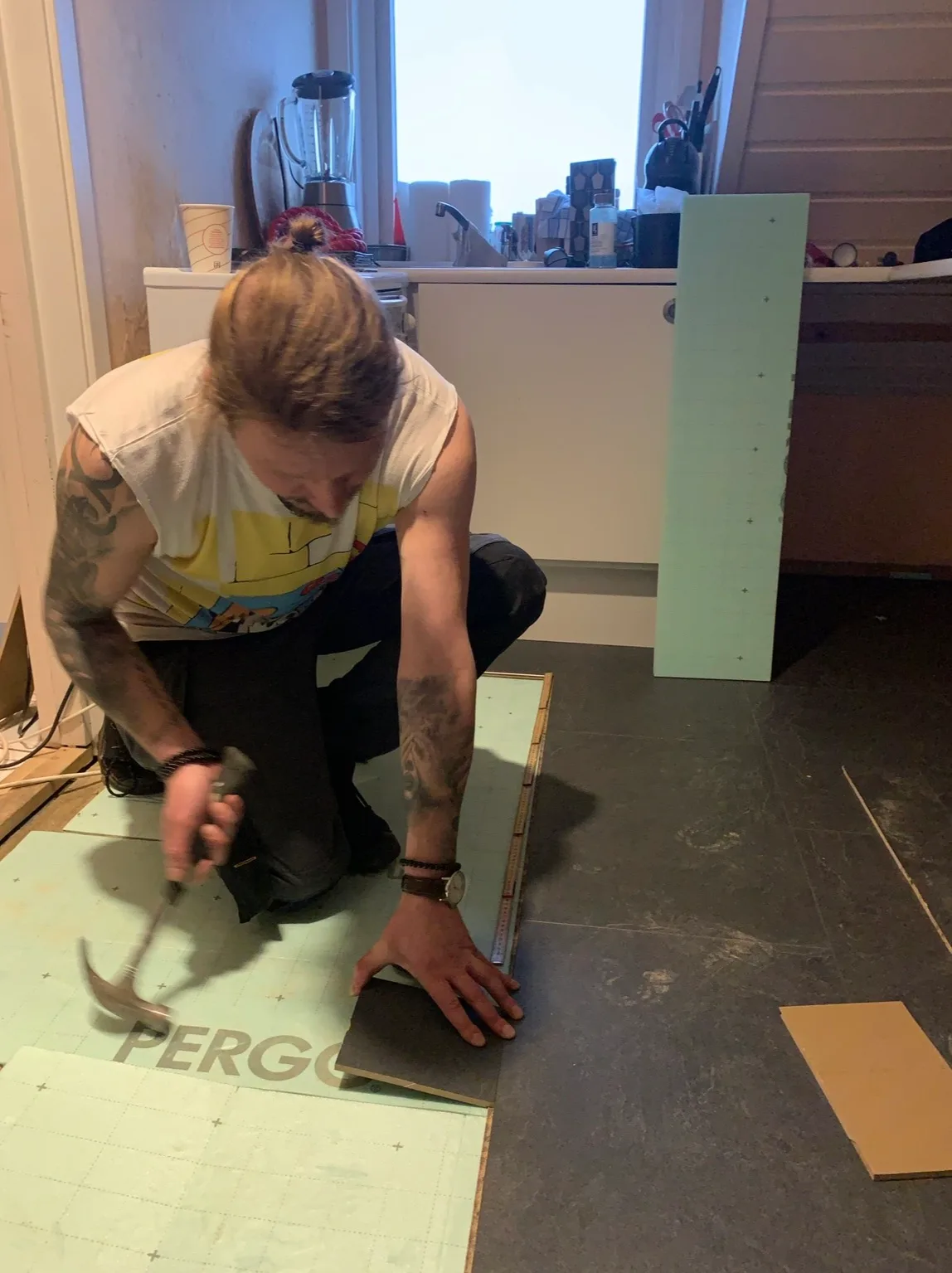 Professional measuring and installing floor samples indoors
