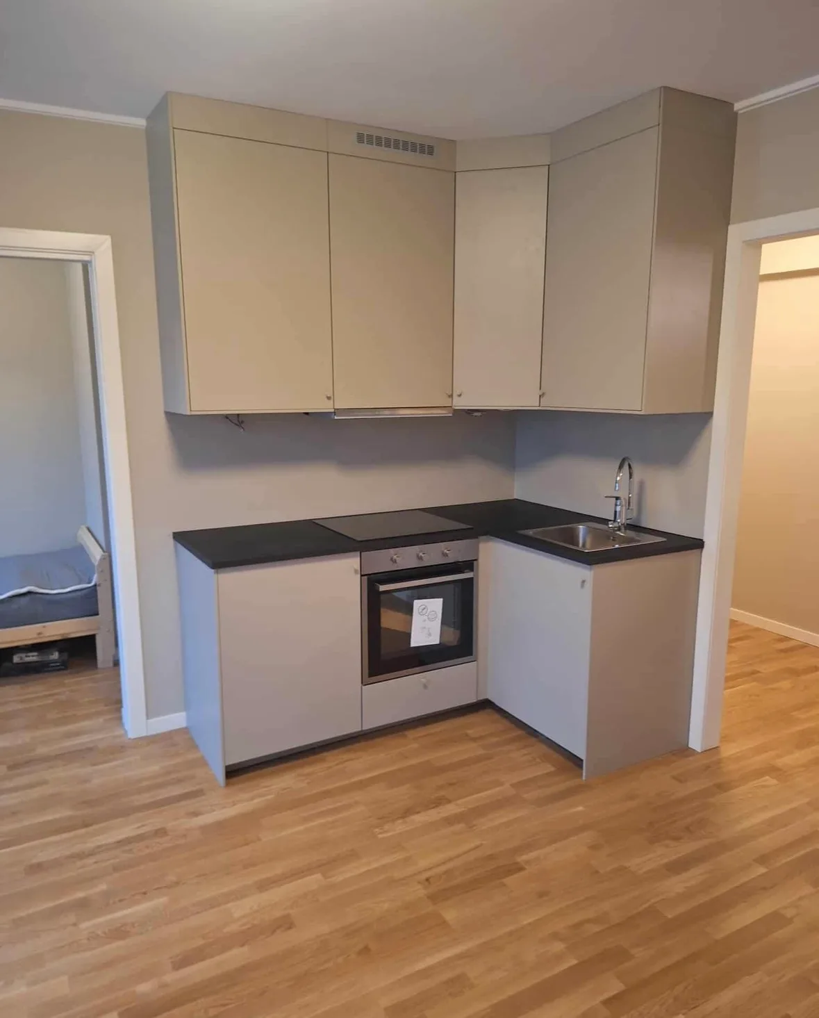 Modern kitchen renovation with cream cabinets