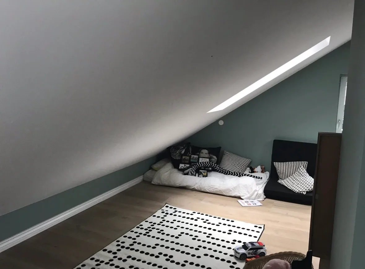Modern attic bedroom with skylight integration