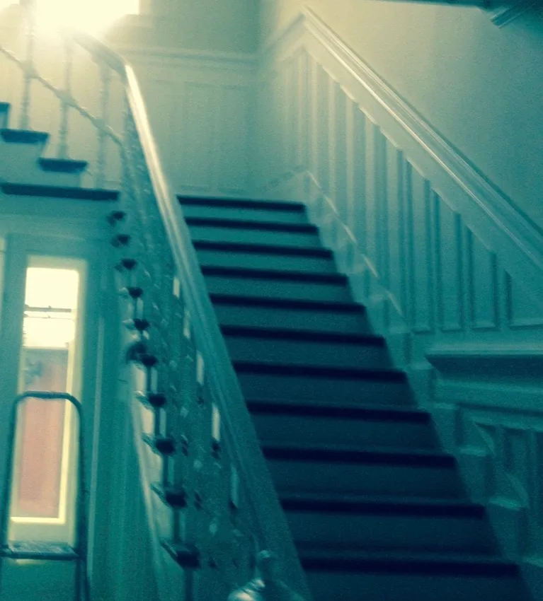 Renovated residential staircase with modern railings
