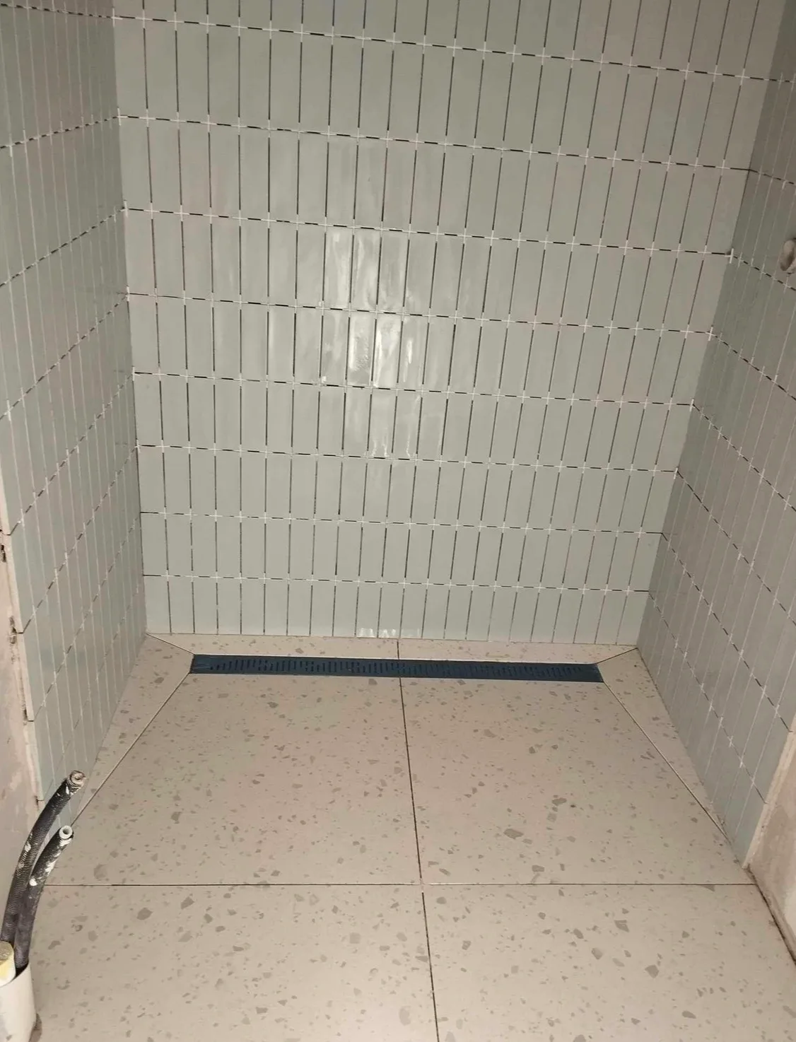 Modern bathroom shower with white subway tiles