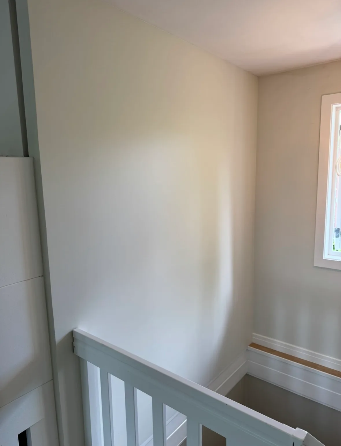 Modern residential stairwell with clean white walls