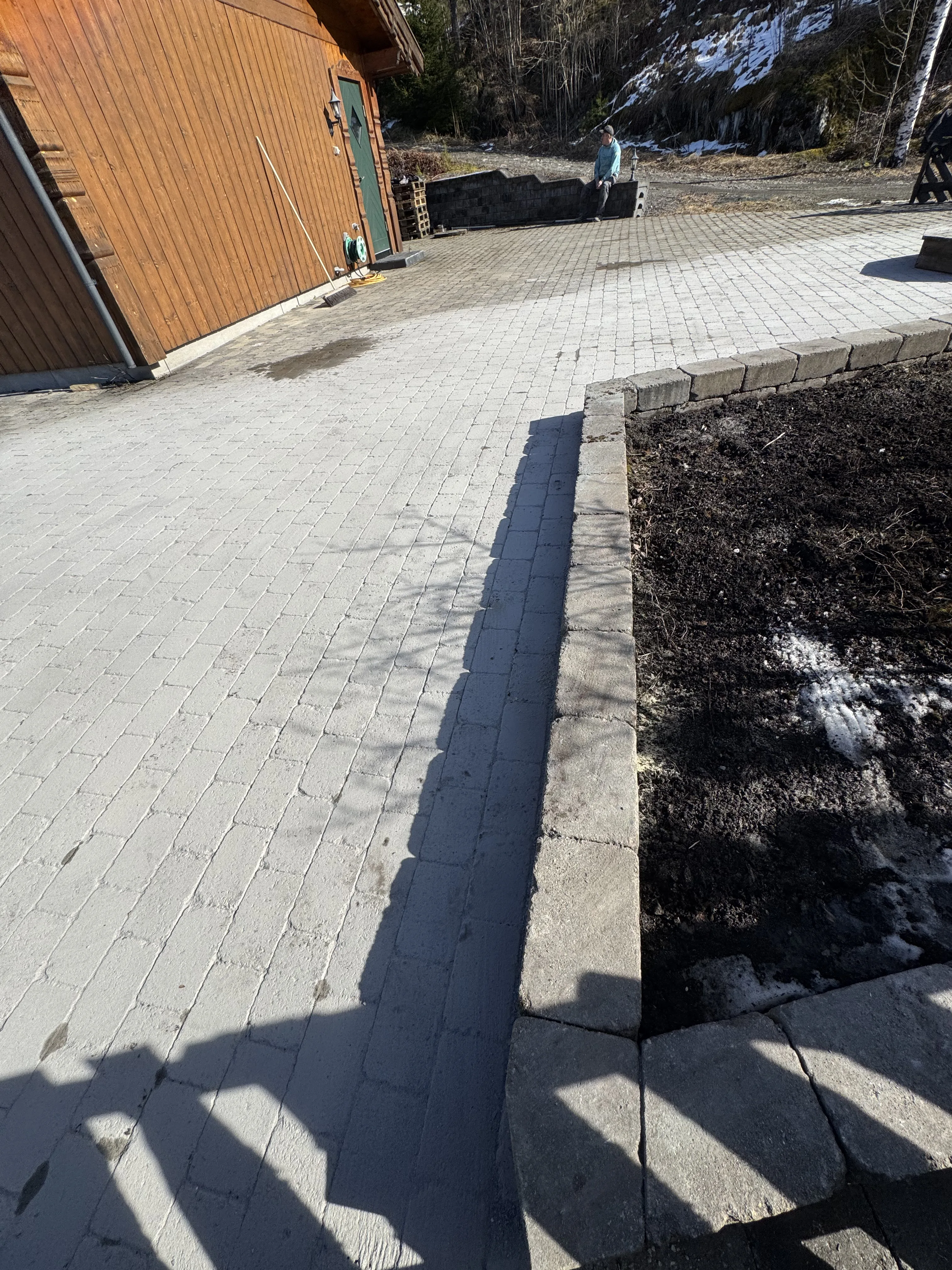 Paved driveway with contrasting dark border stripe